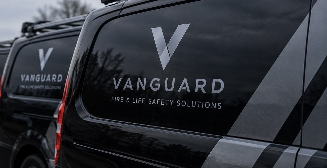 Two liveried Vanguard vans